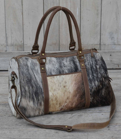 COWHIDE DUFFLE BAG Philbee Interiors 