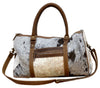 COWHIDE DUFFLE BAG Philbee Interiors 